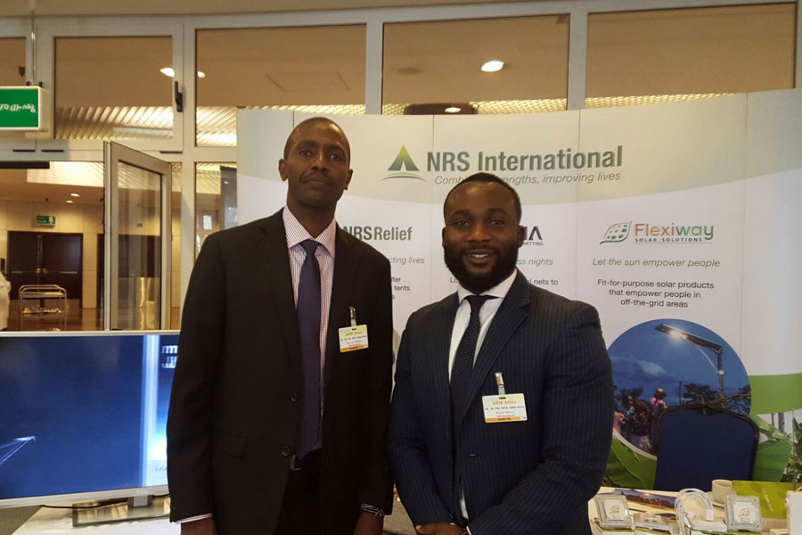 people in front of NRS Relief booth at AIDF Africa Summit 2016