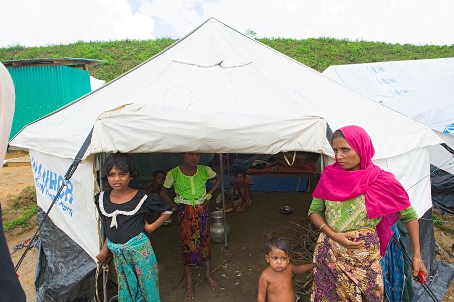 Rohingya refugees front door tent in Kutupalong Bangladesh