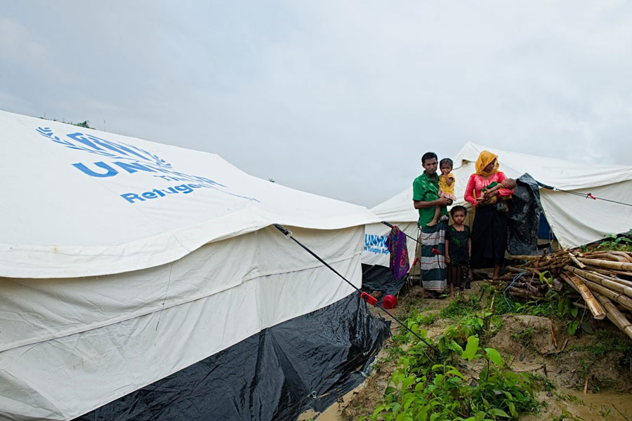 Rohingya refugees standing in front of camp at Kutupalong Bangladesh